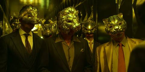 VIPs in Squid Games dressed in suits, wearing masks.