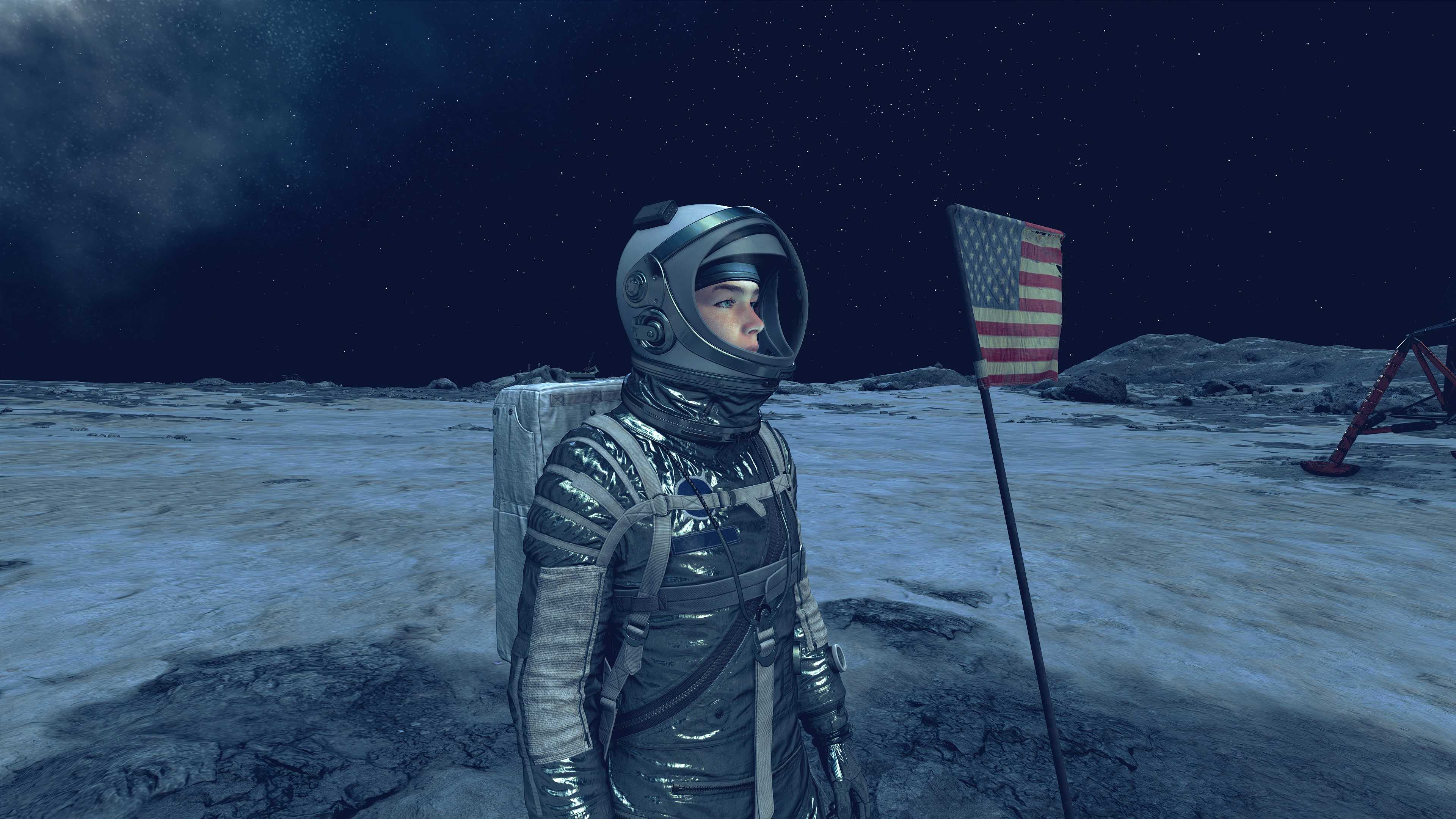 starfield-player-wearing-mercury-spacesuit-helmet-standing-near-american-flag 20 Best Armor Sets In Starfield