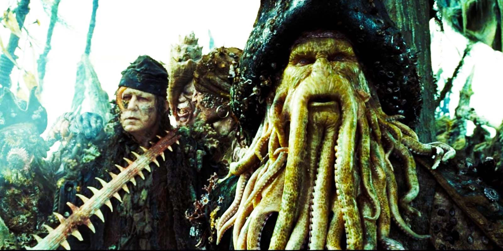 Stellan Skarsgård as Bill Turner and Bill Nighy as Davy Jones look out at the sea with concerned expressions in Pirates of the Caribbean Dead Man's Chest