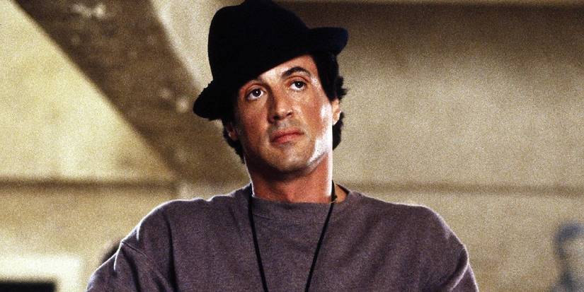 Sylverster Stallone wearing a hat in Rocky while training