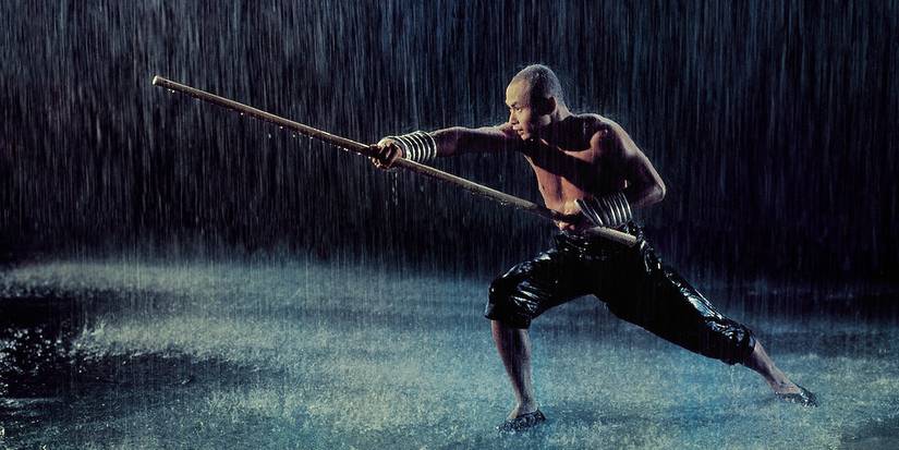 Gordon Liu as Monk San Te trains in the rain in The 36th Chamber of Shaolin.