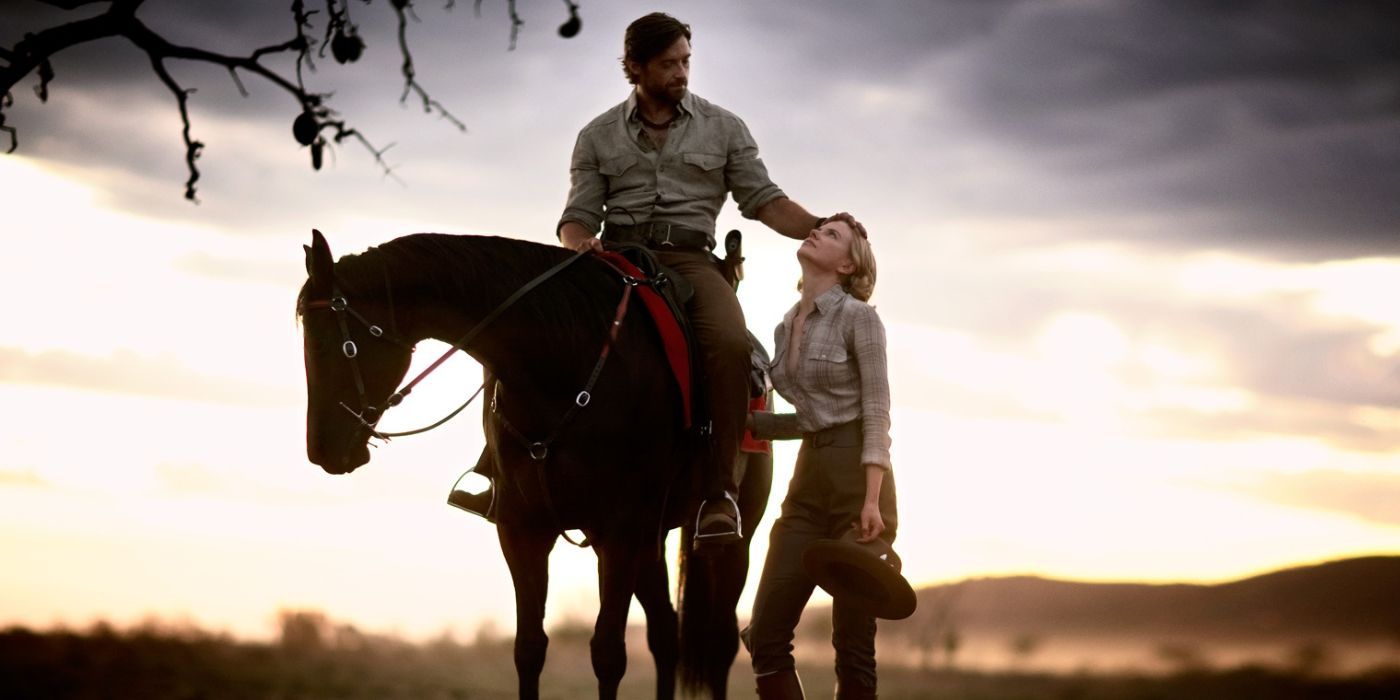 Nicole Kidman stands next to Hugh Jackman on horseback as the sun sets over the Outback in Australia (aka Faraway Downs)