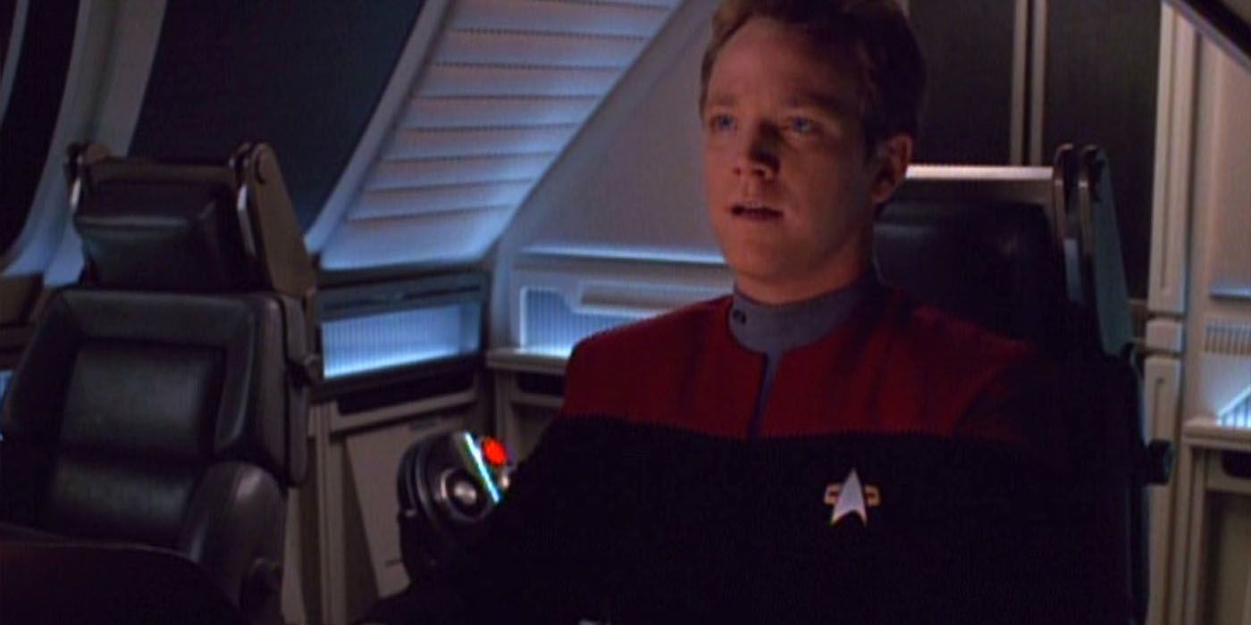 Tom Paris (Robert Duncan McNeill) sits in a shuttlecraft looking forward in the Star Trek: Voyager episode
