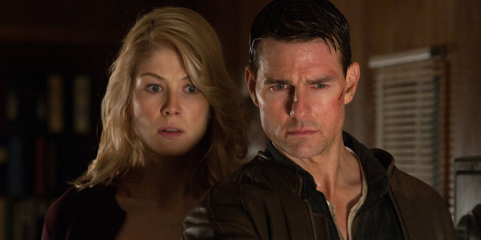 Tom Cruise as Jack Reacher and Rosamund Pike in Jack Reacher 2012