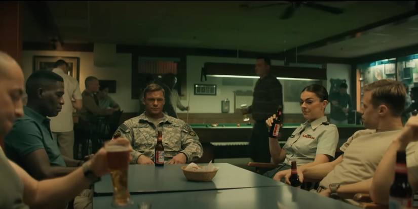 The Special Investigators sitting around a table in a bar in Reacher