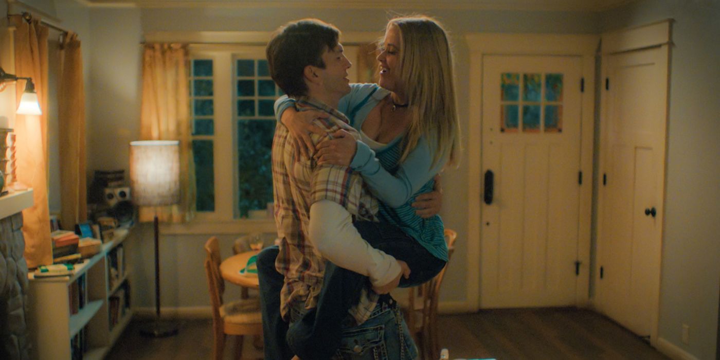 Ashton Kutcher holding Reese Witherspoon in Your Place or Mine-1