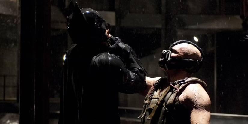 bane grabbing batman by the neck in the dark knight rises