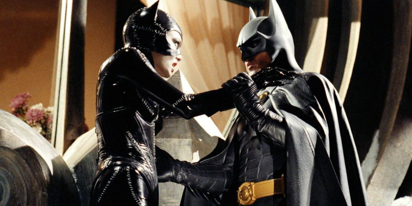 Batman and Catwoman holding each other in the middle of a fight in Batman Returns 