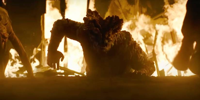 A Bloater emerging from a hole in The Last of Us