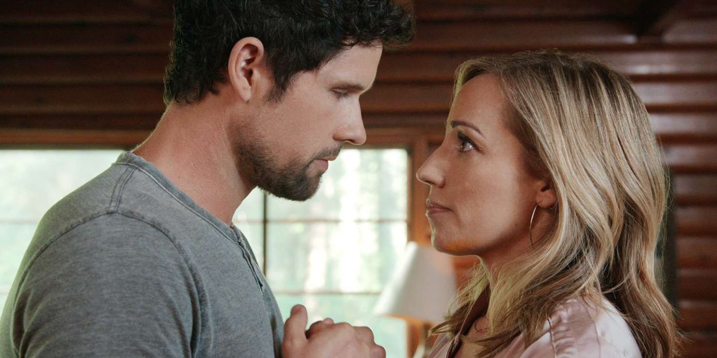 Brady and Brie holding hands and facing each other in Virgin River