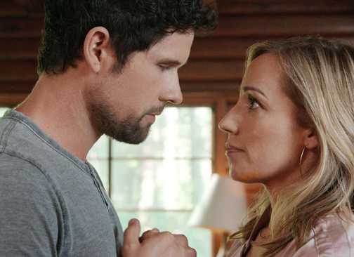 Brady and Brie holding hands and facing each other in Virgin River