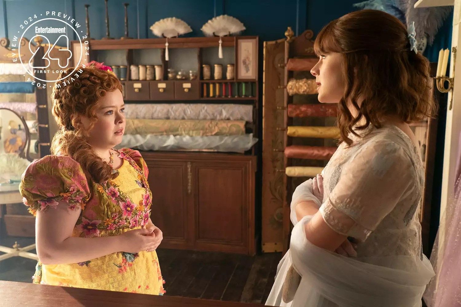 Penelope (Nicola Coughlan) and Eloise (Claudia Jessie) looking at each other in Bridgerton season 3.