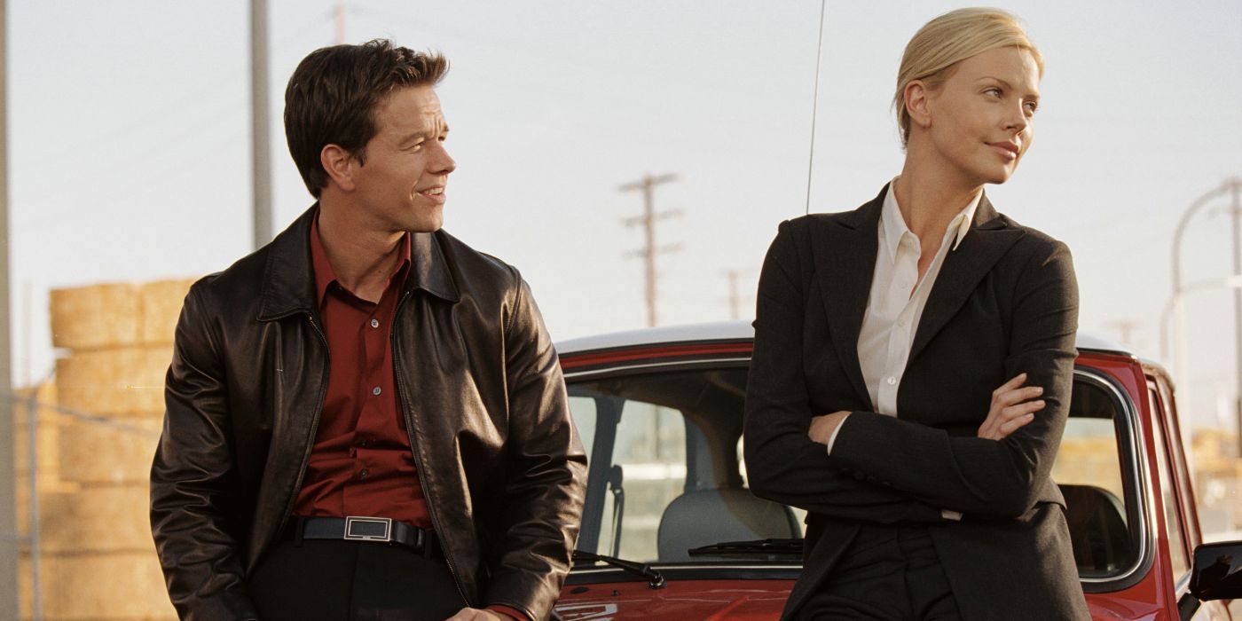 Charlie and Stella sitting on a car in The Italian Job (2003) Mark Wahlberg as Charlie Croker