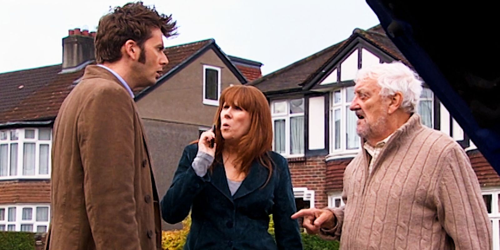 Donna looks confused as Wilf and The Doctor talk to each other in Doctor Who.
