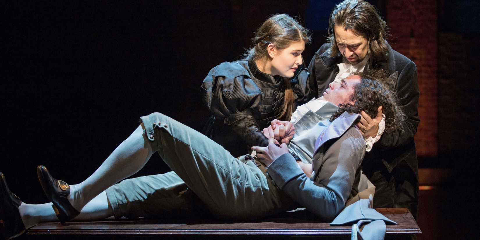 Eliza and Alexander cradling Phillip after he is shot in Hamilton