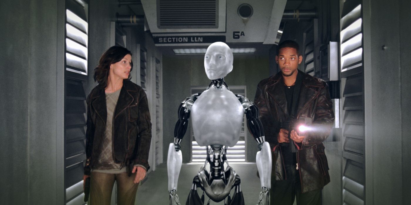 Bridget Moynahan, Alan Tudyk, and Will Smith in I, Robot, walking the robot down the corridor