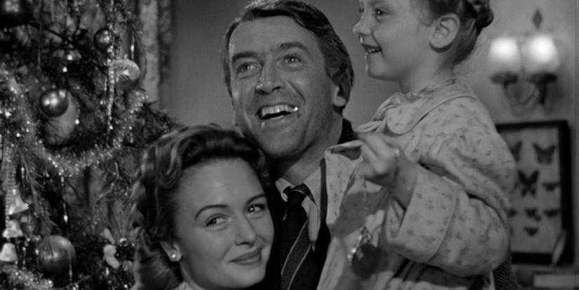 James Stewart as George Bailey with his Family smiling Its a Wonderful Life 