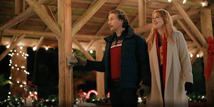 Jack and Mel walk through a Christmas lights display in Virgin River season 5