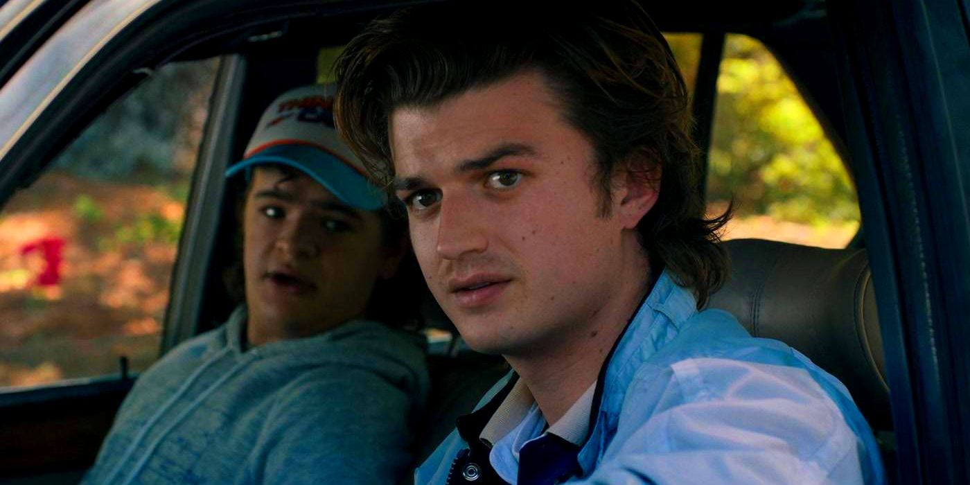 Joe Keery as Steve with Gaten Matarazzo as Dustin Sitting in a Car in Stranger Things Season 4