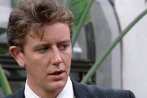 Judge Reinhold as Billy Rosewood stares at someone off-screen in a scene from Beverly Hills Cop