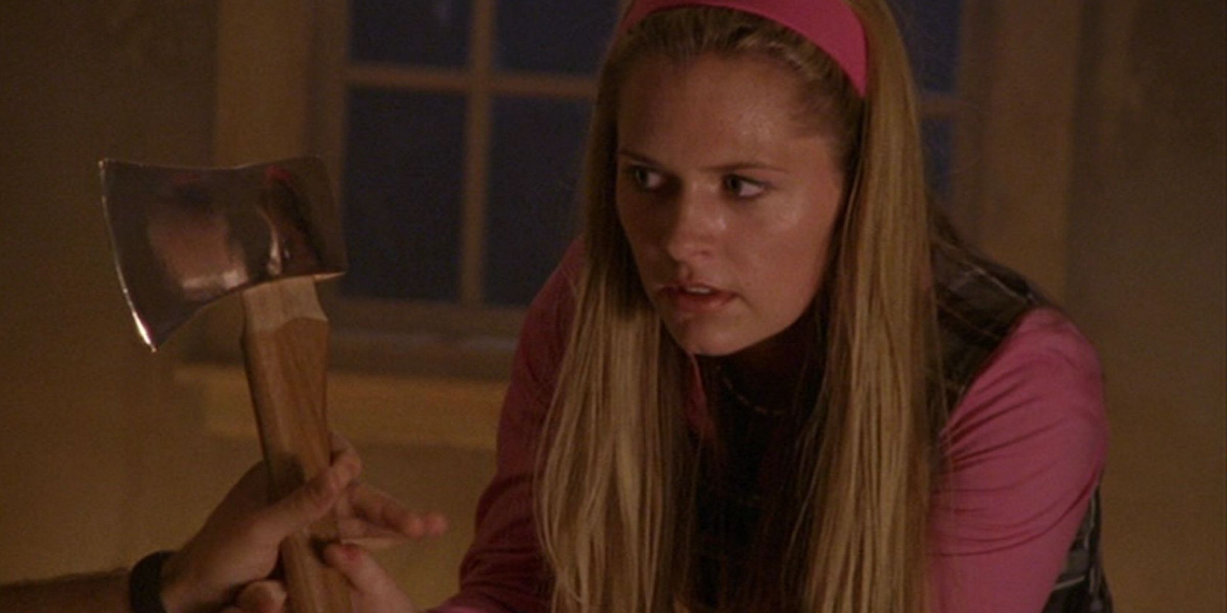 Juliet holding onto an axe while someone takes it form her in the Scary Sherry episode of Psych