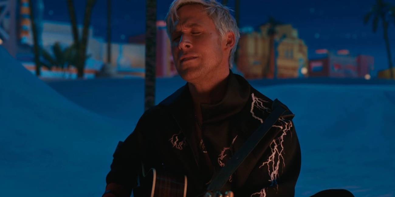 Ken (Ryan Gosling) getting very into playing guitar on the beach in Barbie.