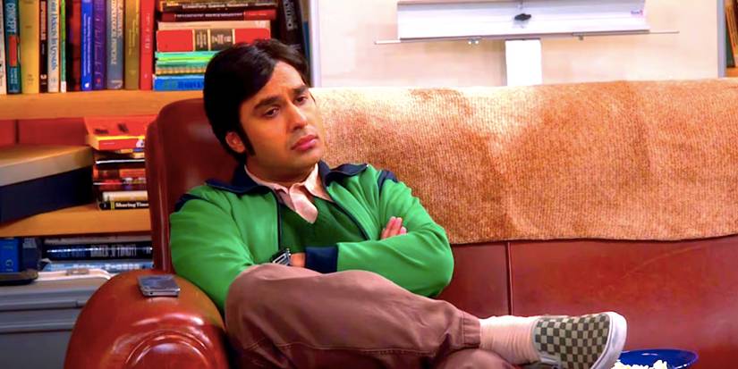 Kunal Nayyar's Raj sits and looks glum on a couch in The Big Bang Theory