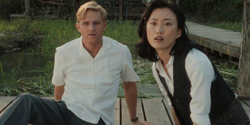 Lee Shaw and Keiko sitting on a dock in Monarch Legacy of Monsters