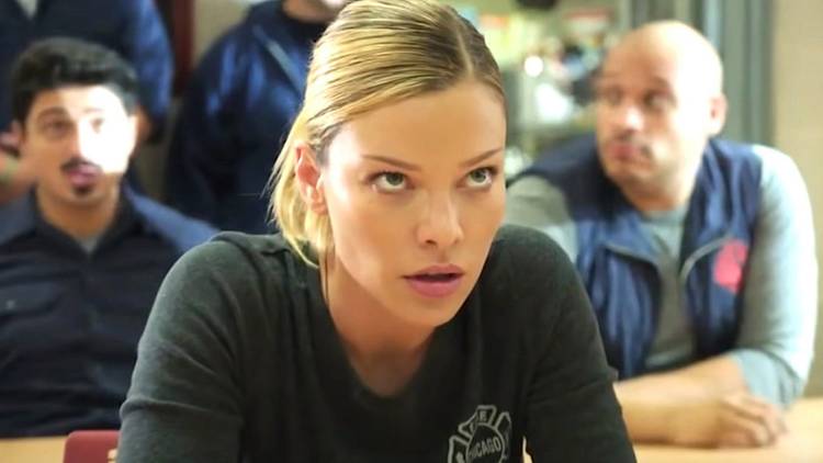 Leslie Shay (Lauren German) in a meeting looking annoyed on Chicago Fire.