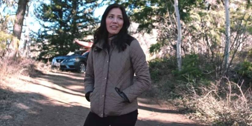 Sarah Nguyen with her hands in her pockets in the wilderness in Yellowstone