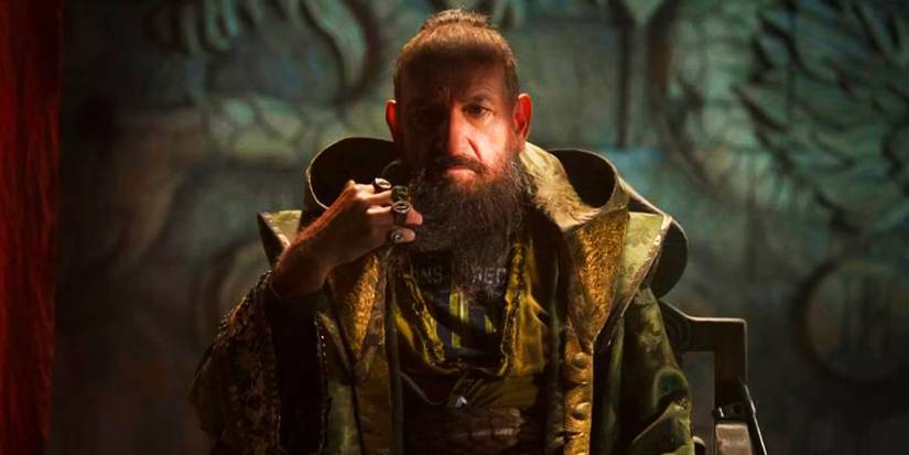 Ben Kingsley as Trevor Slattery/The Mandarin looking into the camera in Iron Man 3