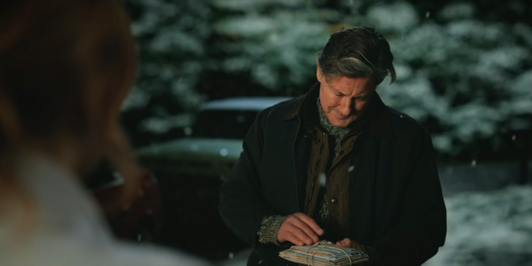 Mel's dad Champ holds letters in Virgin River