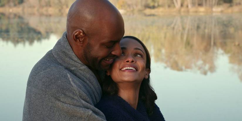 Preacher and Kaia embrace at a lake in Virgin River