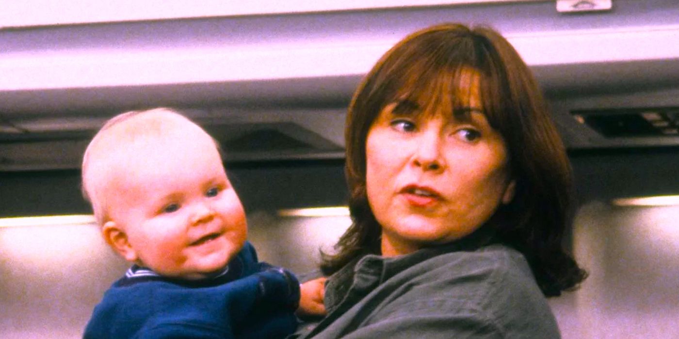 Roseanne (Roseanne Barr) with baby Jerry Garcia Conner in an airplane in Roseanne.
