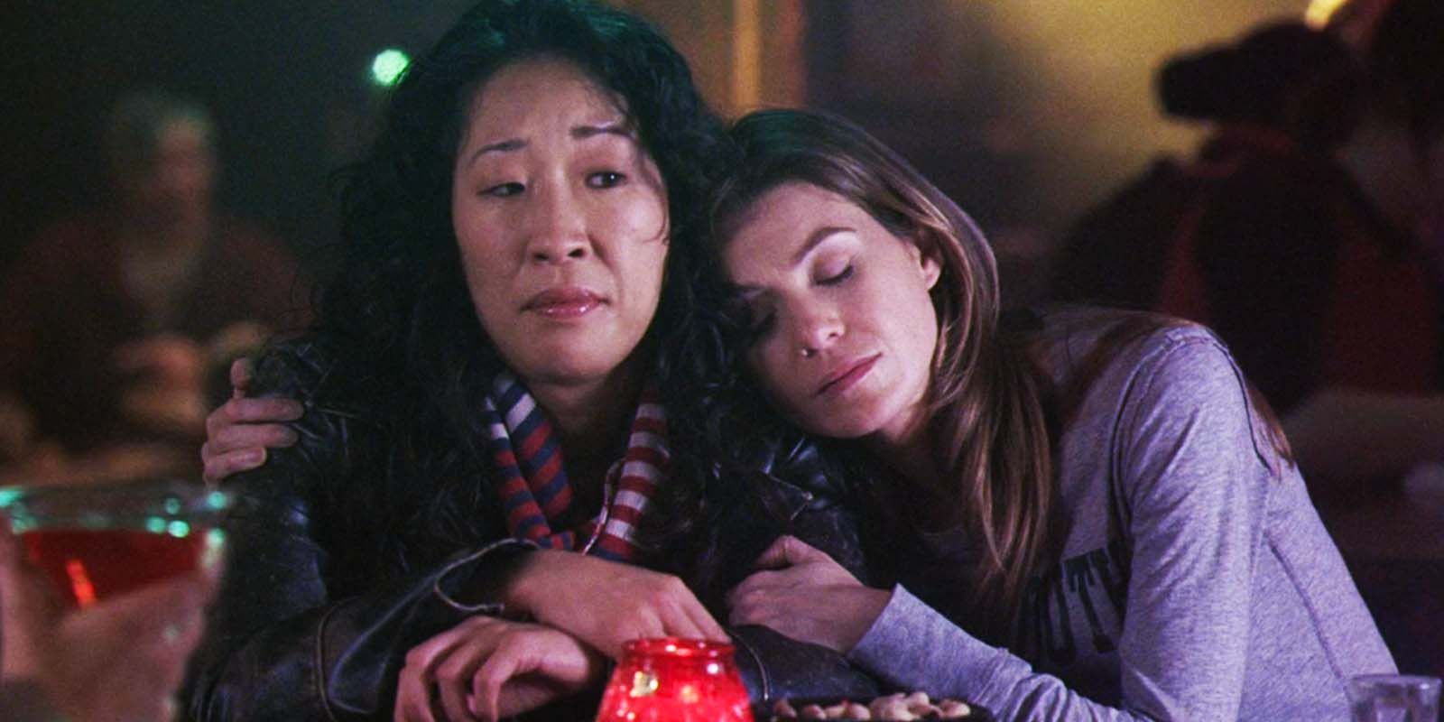 Sandra Oh as Cristina Yang and Ellen Pompeo as Meredith Grey hugging in Grey's Anatomy season 2 premiere