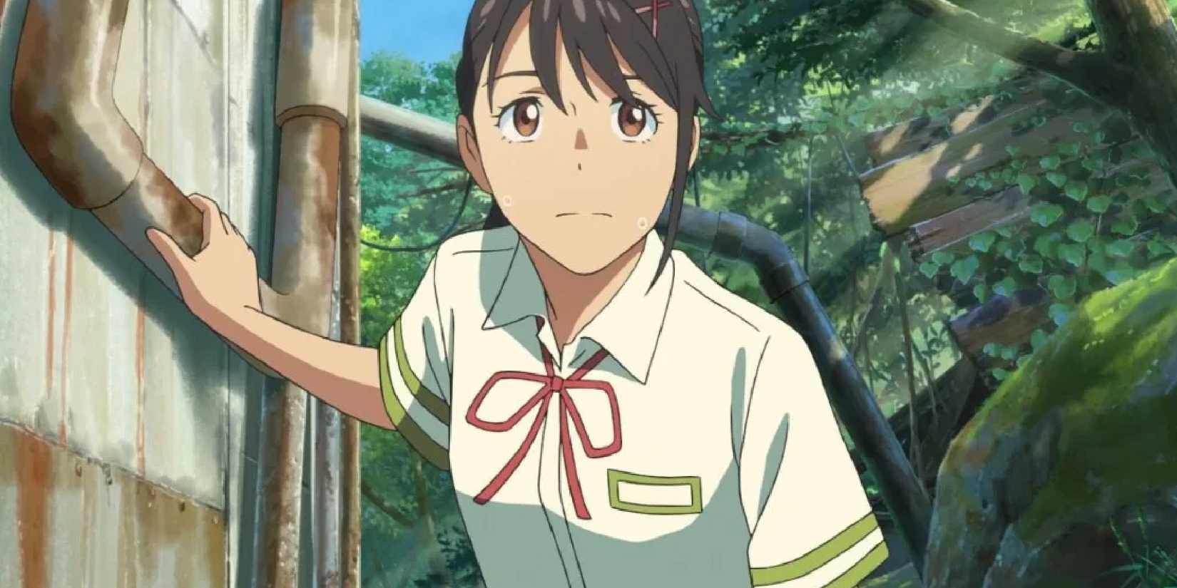 Suzume Iwato from Suzume placing her hand against an old rusty wall while wading through a decrepit forest.