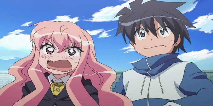 A girl with pink hair stands next to a boy with black hair as they both look shocked.