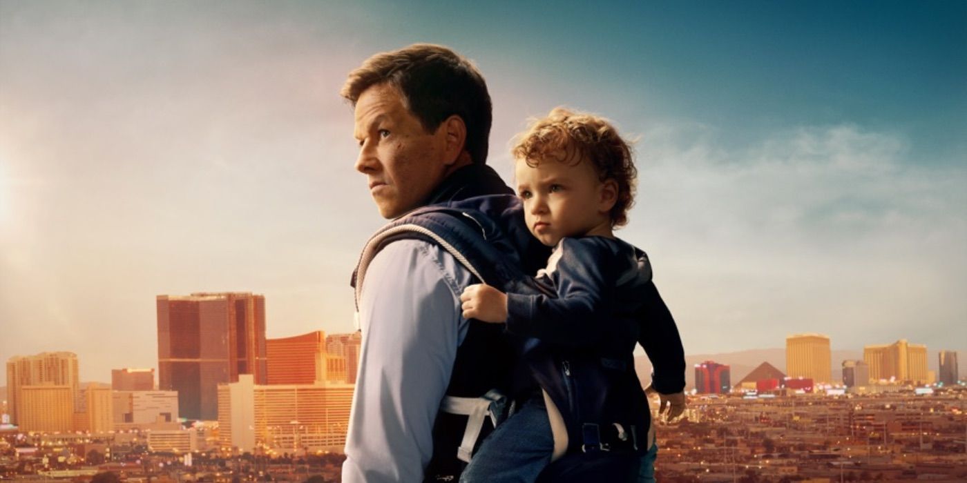 Mark Wahlberg with a baby on his back in The Family Plan
