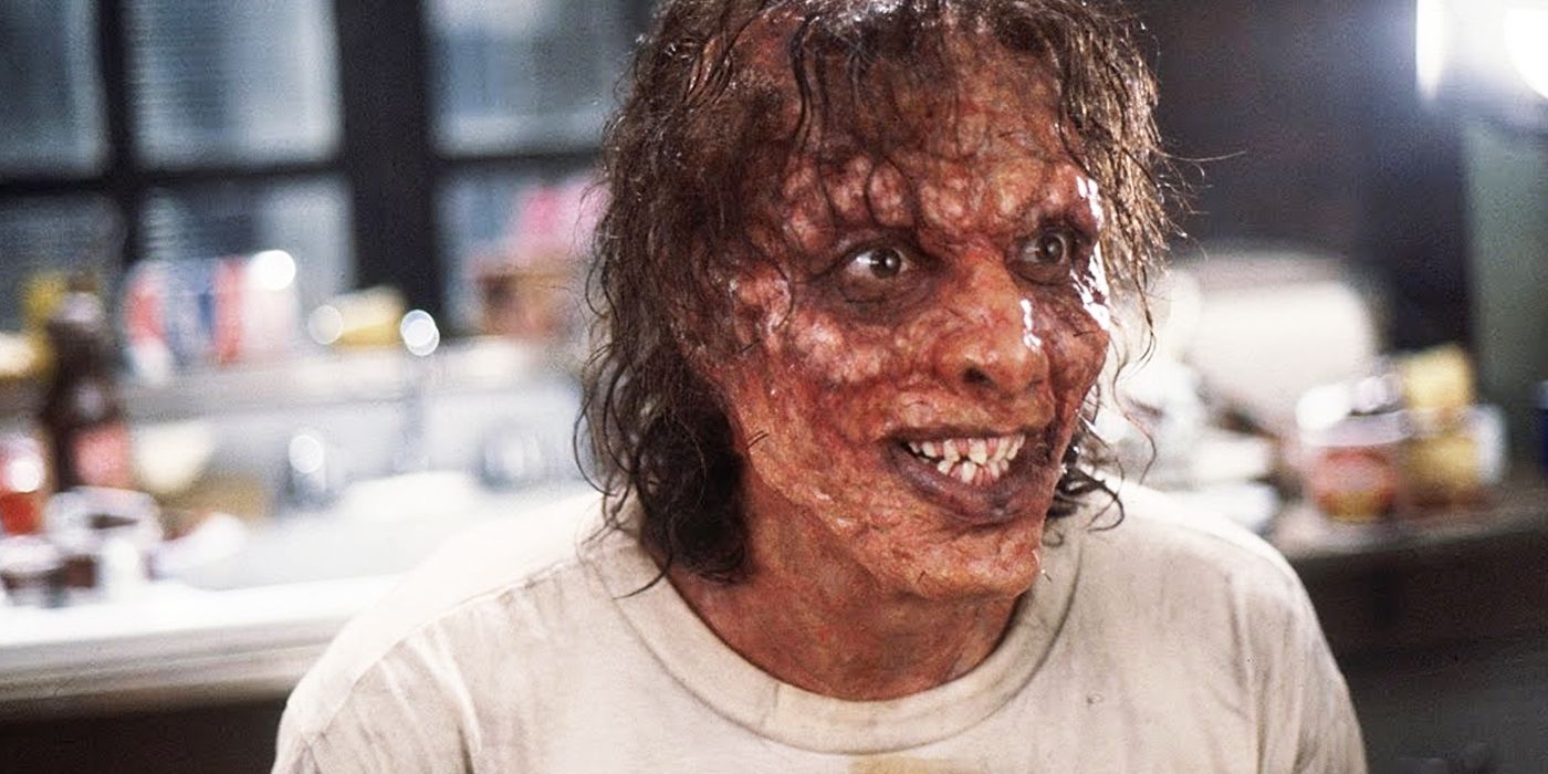 Jeff Goldblum as a deformed Seth Brundle grinning in The Fly