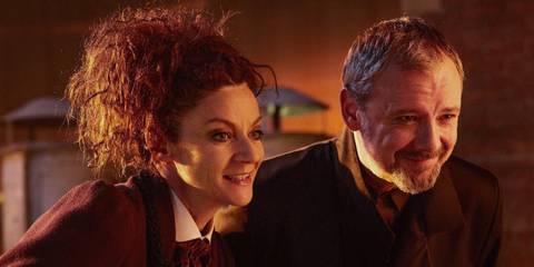 John Simm as the Master and Michelle Gomez as Missy smiling menacingly in the Doctor Who episode 