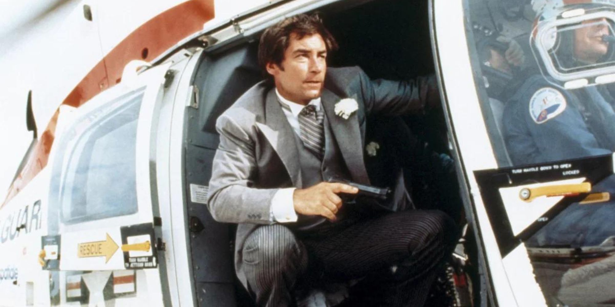 Timothy Dalton as James Bond with a Gun in the Helicopter in License to Kill's Opening Sequence