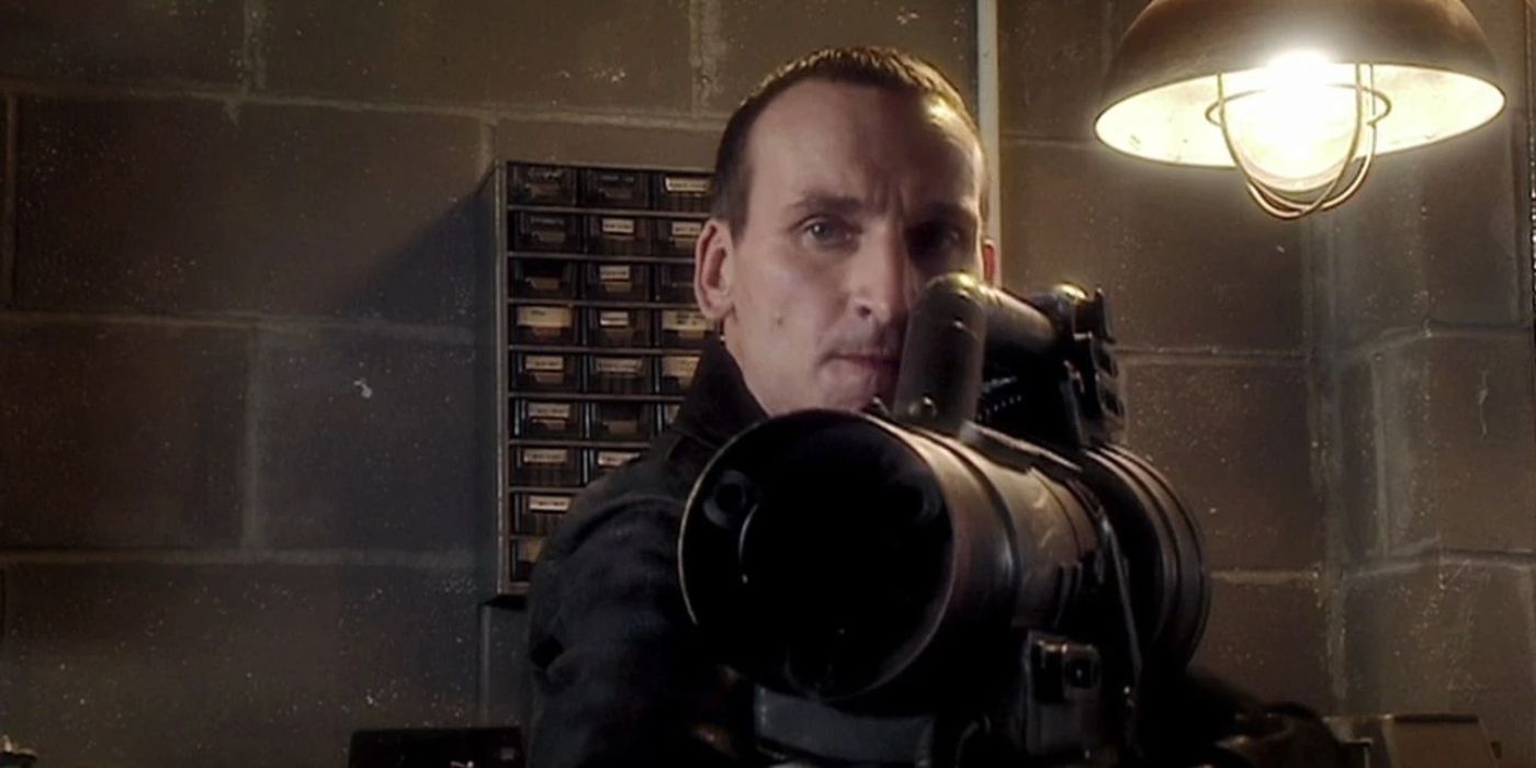 Christopher Eccleston as the Ninth Doctor holds a makeshift blaster in the Doctor Who episode Dalek