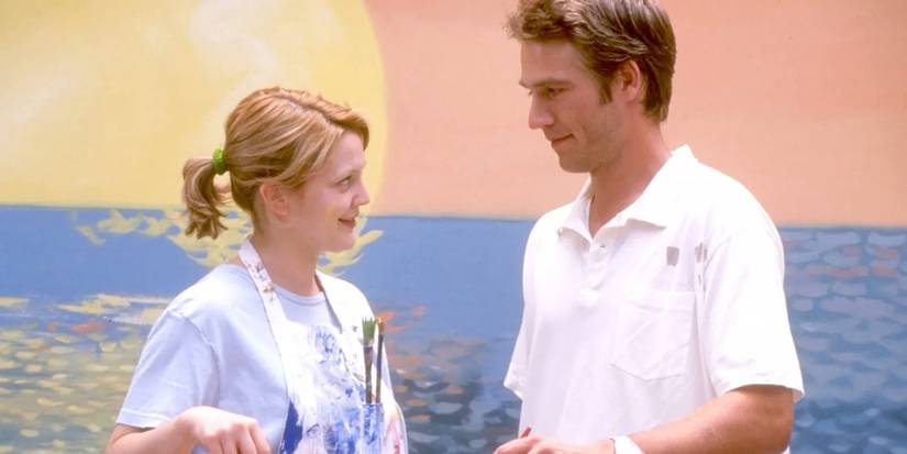 Josie and Sam against a painted sunset backdrop in Never Been Kissed