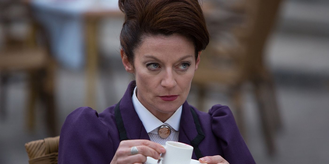 Michelle Gomez as Missy drinking from a mug in Doctor Who