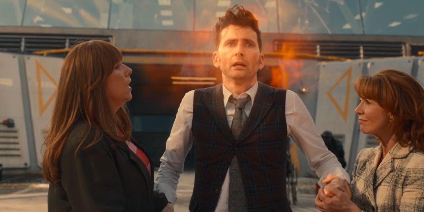 Donna Noble and Mel Bush hold the Fourteenth Doctor's hands as he regenerates in Doctor Who's 