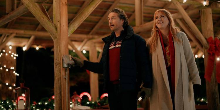 Mel and Jack hold hands at a Christmas event in Virgin River