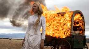 Elsa Dutton stands next to a burning wagon in 1883's premiere
