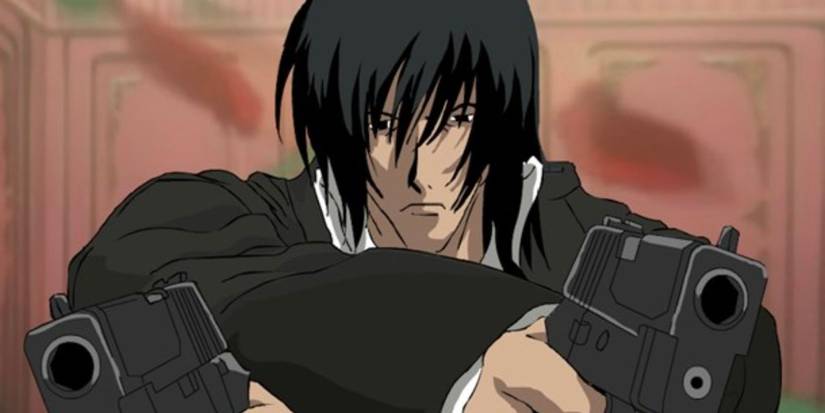 Gungrave screen grab of a young man dual-wielding pistols with a serious expression.