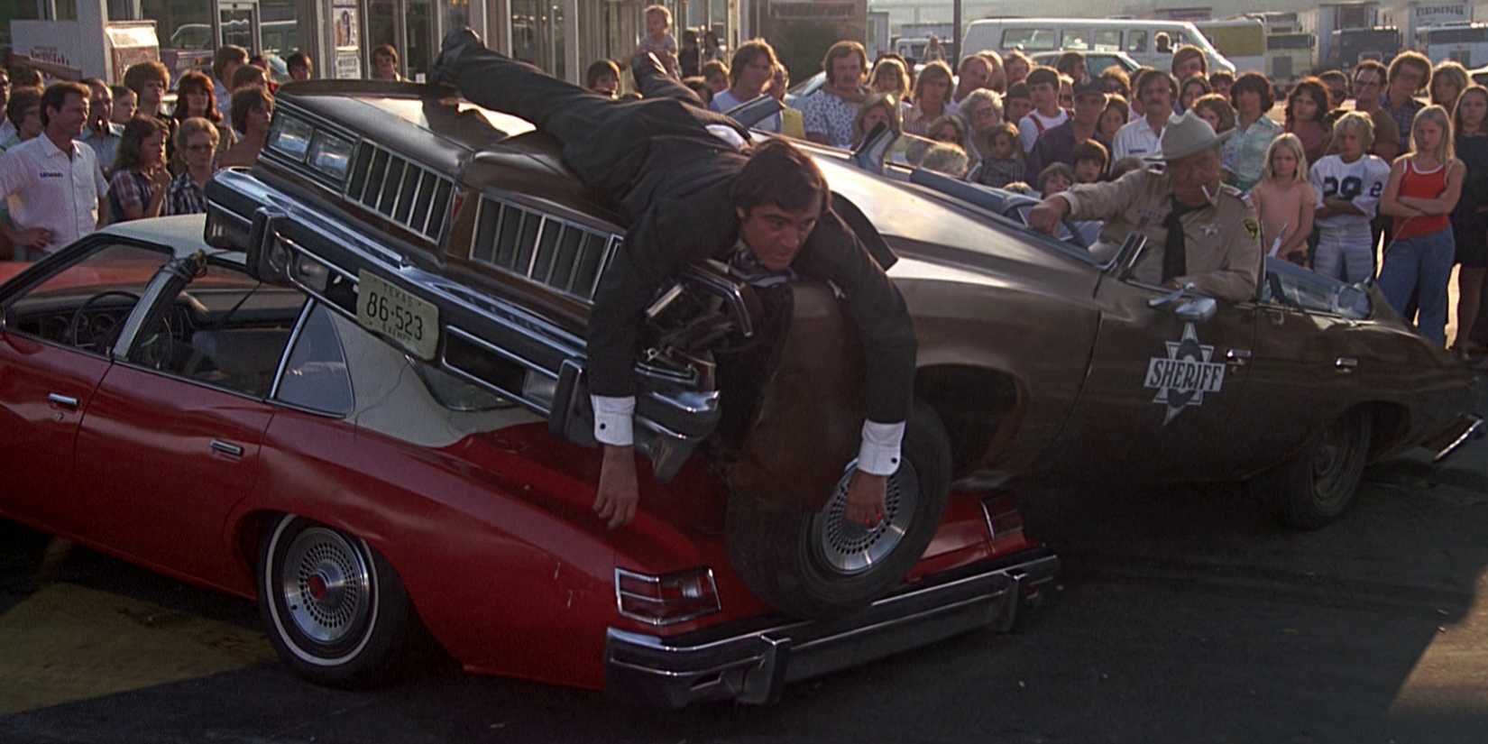 Junior on top of the hood of a crashed car in Smokey and the Bandit