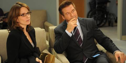 Liz and Jack sitting together in a meeting in 30 Rock